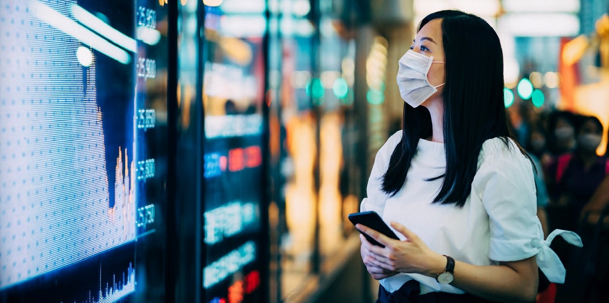 Woman in mask reading data